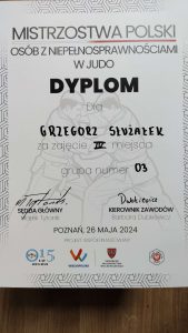 Dyplom dla Grzegorza za 4 miejsce.